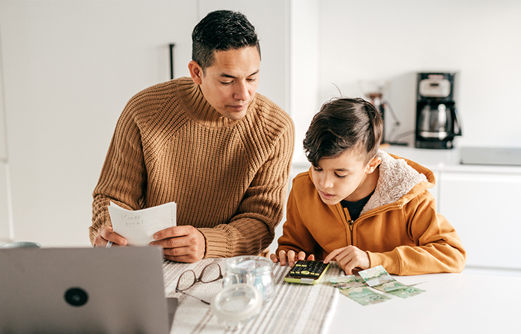 A parent watching their child use a calculator.